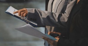 Accountant or banker making calculations Bookkeeper Clerk, Bank Advisor And Auditor. Accounting concept.