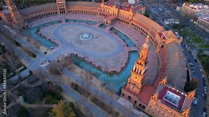 high angle view of downtown Seville, drone shot of Seville skyline, Plaza de Espana in Seville, aerial view in the morning at sunrise, flying around famous Seville landmark.