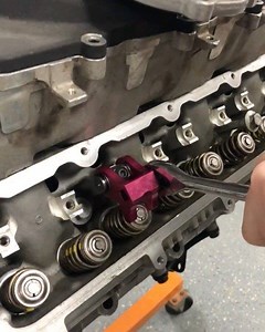 By far the best LS / LT valve spring tool we have ever used! This thing makes changing springs soooo easy without worrying about pulling rocker arm threads out of the head! https://www.motionraceworks.com/pages/search-results-page?q=valve spring tool | Motion Raceworks