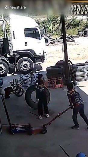 Over-inflated lorry tire explodes at mechanic's repair shop | Rev It Up