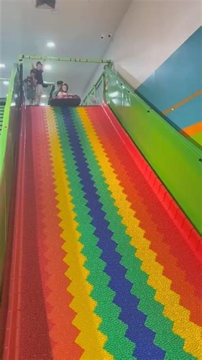 Rainbow Slide Fun at Indoor Playground