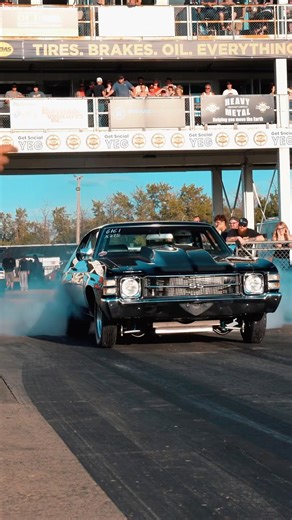 Chevelle with a procharger laying down some rubber