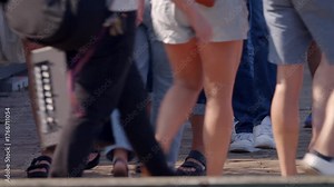 Tourists Walk Along The Iconic Wooden Boardwalk Of Halifax Nova Scotia Canada During Summer, Enjoying The Waterfront And Vibrant Urban Energy.Feet Of People Walking On Halifax Boardwalk