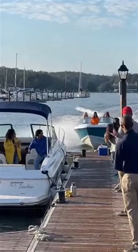 Speeding Boat Slams Into Marina Dock During Lakeside Party Annapolis, Maryland — A high-speed ride through a crowded marina ended abruptly when a small motorboat collided with a dock during a sunny afternoon gathering. The incident occurred near residential waterfront homes and moored vessels. Video shows the boat traveling at full throttle through the marina channel with several women standing near the bow. As the vessel approaches the docking area, it fails to slow in time. The bow strikes the