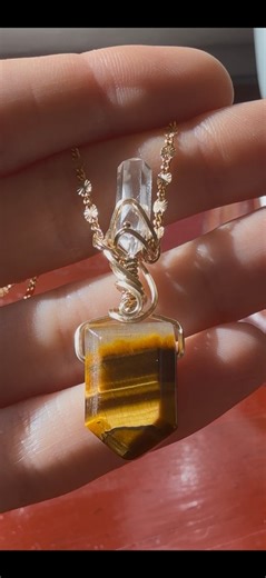 l've been dreaming of making some Practical Magic inspired jewelry. It's one of my favorite witchy movies to watch every autumn. Here is my version of Gilly's Tiger's Eye amulet for protection & good luck. 🌟 This design will be entering the shop at 5 pm est this Friday, October 17th. 🐅 #practicalmagic #tigerseyejewelry #quartzjewelry #magicaljewelry #crystalamulet #quartznecklace #fantasyjewelry | Druzy Daze