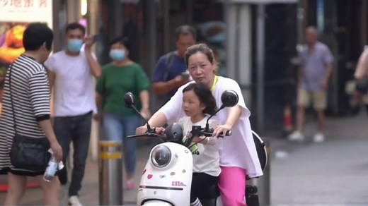 China pushes three child policy