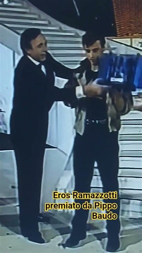 EROS RAMAZZOTTI AWARDED BY PIPPO BAUDO AT THE 1984 SANREMO MUSIC FESTIVAL