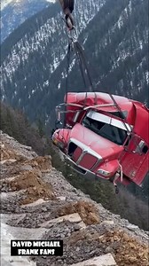 A semi-truck tumbles down a steep Colorado mountainside during a recovery attempt, rocks and debris flying as dust clouds rise. | David Michael Frank Fans