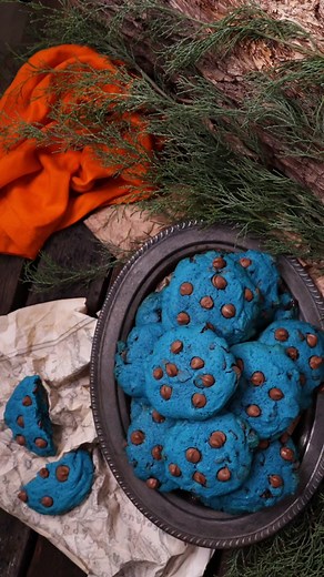 Liquid food coloring can be tricky to work with in baking. But here's a quick trick for serving vibrant-coloured Percy Jackson blue chocolate chip cookies. Microwaving a small portion of the colored dough “activates” the food coloring. Heat can intensify food coloring, making the colors appear brighter and more vibrant. Some additional tips: only microwave some of the cookie dough. Melted butter vs. cold butter vs. room-temperature butter changes how cookies turn out when baked. Liquid food colo