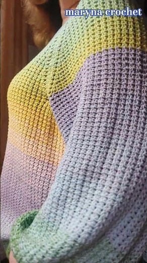 A bright, colorful sweater crocheted from cotton yarn. Crochet stitch tutorial pattern #crocheting