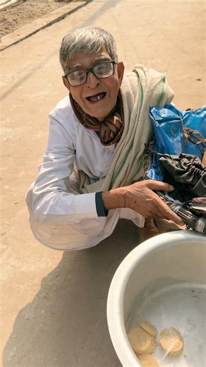 I met him near Harinavi D.V.A.S. High School. He delivers in and around this area. If you wish to order sweets from him, you can coordinate with him and collect from this area. He doesn’t have a mobile phone so I’ve given his daughter-in-law’s contact number for the same. When you call him, kindly ask the phone to be given to “Dadu”. 😇🤌 📍Location: Harinavi D.V.A.S. High School, Harinavi, Kolkata Phone Number: ( 91) 7384009562 [Sweet Seller, Affordable Street Food, India, Human Stories, Real S