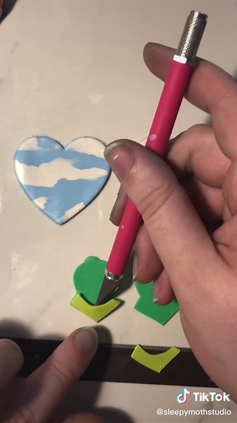 🌈Rainbow connection hearts coming to the shop soon! Also my fingers are blue from hair dye I’m not a zombie I promise #kermit #earrings #polymerclayearrings #EasyWithAdobeExpress