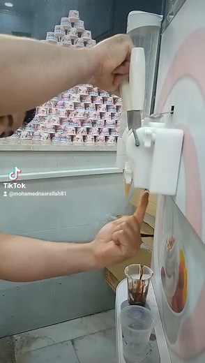 Chocolate Ice Cream Dispensing in Ice Cream Shop