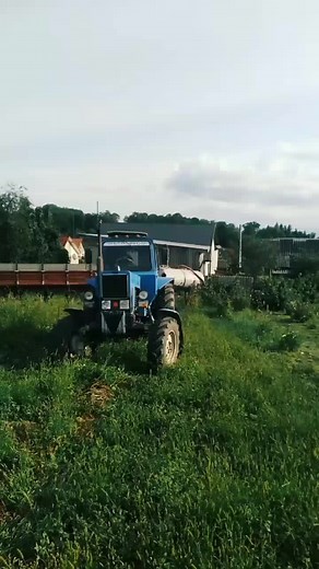 BELARUS Tractor Plowing in a Grassy Field