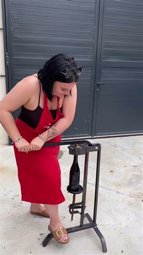 Closing a huge wine bottle with a manual corking machine.🍷@domainedelodylee #cork #wine #bottle