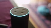 Close up on an activated virtual assistant smart home device speaker