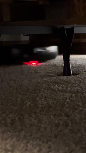 Lg Hom-bot cleaning under a bed