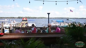 Located on beautiful lake tarpon this picturesque Key West themed waterfront restaurant has an indoor/outdoor bar, a large outdoor patio and 16 slips to accommodate boaters. So whether you come by land or come by lake grab a table or seat at the bar, enjoy the view and select from our 50 item island inspired menu featuring delicious appetizers, great sandwiches, awesome tacos, fantastic flatbreads, & tantalizing rice bowls. This array of Caribbean dishes is sure to please everyone in your party!