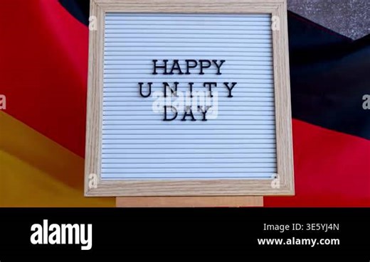 Letter board with message HAPPY UNITY DAY National symbol of Germany. German wave silky flag background. Concept of historical remembrance and public holiday Stock Video Footage - Alamy