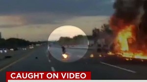 Man on fire leaps from burning truck