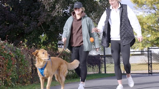 Marie-Philip Poulin, Laura Stacey, and Arlo, the dog that changed their lives
