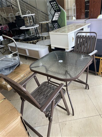 Replying to @Gmoney Comprises of 2 foldable chairs and one large tempered glass table. Compact, stylish, and built for comfort — this outdoor folding table set is perfect for your balcony, patio, or small garden space. ☕🌿 Durable metal frame with a textured glass top, paired with two foldable chairs for easy storage and convenience. Ideal for morning coffee or relaxed evening chats. #foldablechair #outdoorset #diningtable #balconyset #foryou
