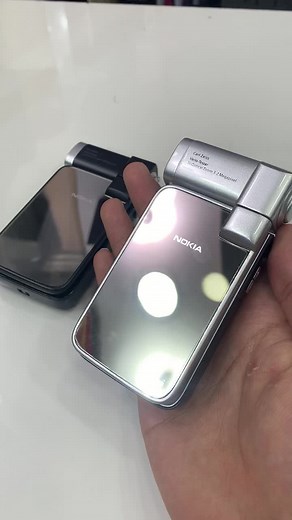 Exploring Classic Nokia Flip Phones: Black and Silver Models