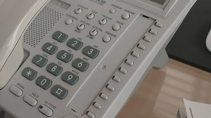 Hand dialing a phone - Free Stock Video