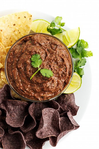 Dip it like it's hot 🔥 This black bean dip is perfect for the next time you host, or your next snack! Ingredients 15 ounce can black beans (drained and rinsed) 1 cup salsa ¼ cup lime juice 1 cup cilantro 2 cloves garlic 1 teaspoon cayenne 1 teaspoon smoked paprika ½ teaspoon salt celery sticks and tortilla chips (to serve) 2 chipotle peppers in adobo sauce (optional)​ Instructions Place all ingredients in a high-speed blender and puree until smooth. Check for seasoning and add more salt if need