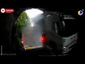 Police release dashcam video showing moment HGV crashes in bridge and nearly crushes van in Surrey