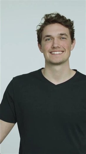 Close-up of model wearing the T-shirt in action (running/gym)