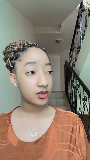 Stylish Rust-Colored Dress in a Stairwell Setting