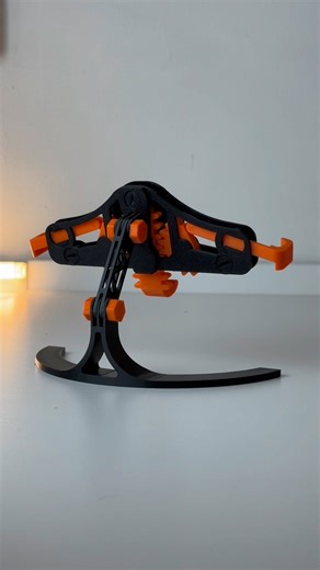 ThisIs3DPrinted on Instagram: "3D printed mechanical quick-grab/release phone stand ⚙️ 🧵Filament: @3dhojor_official - PLA Pro Orange - Rapid PLA Black #3dprinting #3d #3dprint #bambulab #p1s #maker #satisfying #craft #design #diy #iphone #accessories #stand"