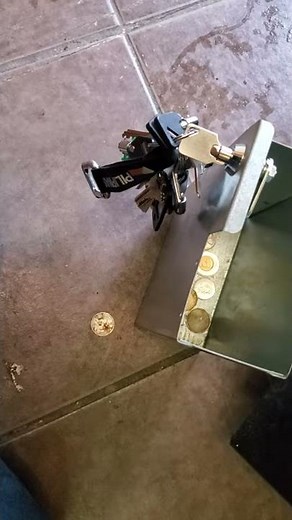 Pop machine malfunction caused by a bent coin