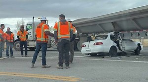 Two hospitalized after car wedges under semi-truck trailer in Tooele County