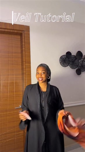 Salih Ruqaiyyah on Instagram: "I’m so in love with this veil colour 🧡❤️ So pretty beautiful 😍 But the struggle that comes with it is something else, I tell you. Silk scarves are always pretty, but having to wrap them is always the problem 😫😫 Am I getting one again? Yes, definitely 🫠😭 My girlies, let me know your experience with wrapping silk scarves 🤧 I’m sure I’m not alone. #explor #veiltutorial"