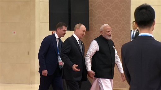 Putin and Modi hold hands at China's anti-Nato summit