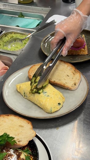 Our Classic Omelette is the quiet achiever of the menu. 🍳 Fluffy, warm and packed with cherry tomatoes, spinach, mushroom, parmesan and topped with grilled courgette. Simple, fresh and perfect for a slow morning by the beach at Island Market. | Island Market Trigg