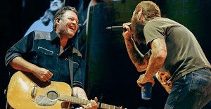 Blake Shelton Surprises Post Malone's Nashville Crowd By Joining Him Onstage For "Pour Me A Drink"