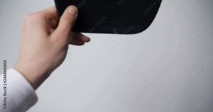 Male (Female) The hand clearly shows very closely how to wear a cap. Concept of: Training, From the first person, Blue cap, Teachings.