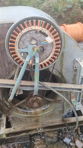 A washing machine motor starts this video, you can see the permanent magnets passing the coils and generating electricity that i use in my workshop. I have reused a bicycle axle so I could fit it to a bicycle. I then mounted it on the side of a air handling fan with the blades closed off that turns the first cog attached to the chain. I have it all held on the side with some unistrut and brackets. I show how to build, run and maintain these turbines on my page so please like share and follow to 