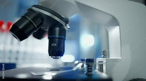 Close up of a optical scientific microscope in laboratory. Science research technology and experiments. Concept of clinical lab and medical equipment.