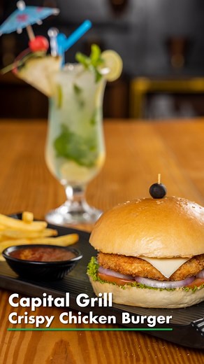 Big, bold, and bursting with flavor! 🍔🔥 Our Capital Grill Crispy Chicken Burger is a continental masterpiece—juicy, perfectly grilled, and layered with all the good stuff. One bite, and you’ll know why it’s a Capital Grill favorite! 😉🍽️​ For Reservations Contact:​ 📍 Kalimati: 01-5922559​ 📍 Tangal: 01-4537674​ 📍 Jhamsikhel: 01-5444011​ 📍 Min-Bhawan: 01-4622423​ #ChickenBurger #BurgerPerfection #CapitalGrill #ContinentalFlavors #KathmanduEats #FoodieFix #JuicyAndDelicious | Jimbu Thakali b