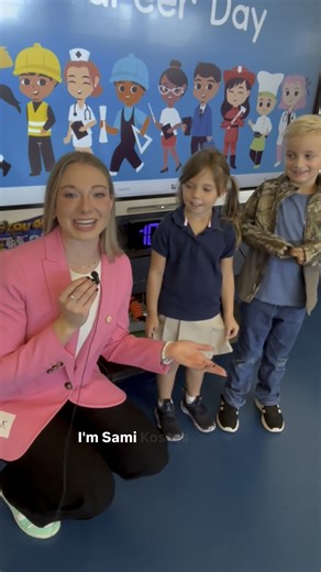 13WMAZ sports anchor Sami Kostas talks to kids at Heard Elementary's Career Day