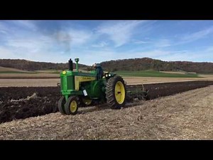 John Deere 730 plowing with 4 bottom