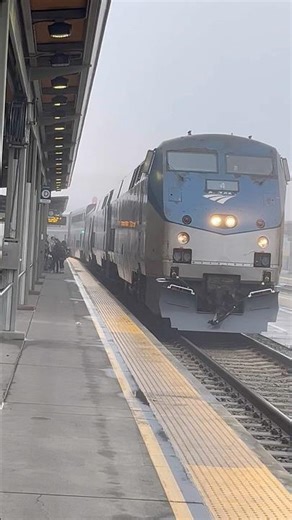 Amtrak California Zephyr 6 emerges from the fog in Sacramento, train engine delight with bell, horn