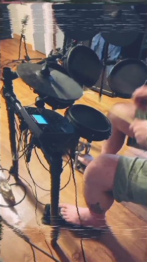 Jamming on an Alesis Nitro Mesh kit with added reverb on PA system