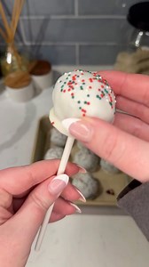 these viral holiday oreo cake pops are so festive and yummy! 🎄😋 Ingredients: 1 package holiday @oreo cookies 1 block cream cheese 1 cup white chocolate chips dab of coconut oil holiday nonpareils sprinkles Instructions: Crush oreo cookies until finely crumbled (or blend in a food processor if available). Pour crumbles in a large mixing bowl and top with room temperature cream cheese to form a dough ball. Separate small sections of cookie dough and form into cake pop bites and set aside on parc