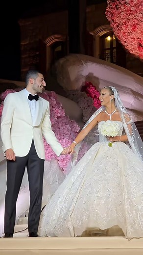 A custom song, an #ElieSaab gown and a bride stepping into a full pink floral fantasy💖! #lebaneseweddings #bride #pinkwedding #pink #bridalentrance #wedding #viral #viralreelschallenge #reelschallenge | Lebanese Weddings