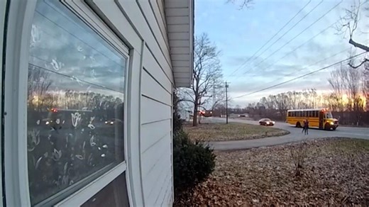 Car nearly hits two children boarding school bus